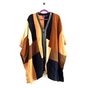 Knit poncho with zipper and faux leather trim